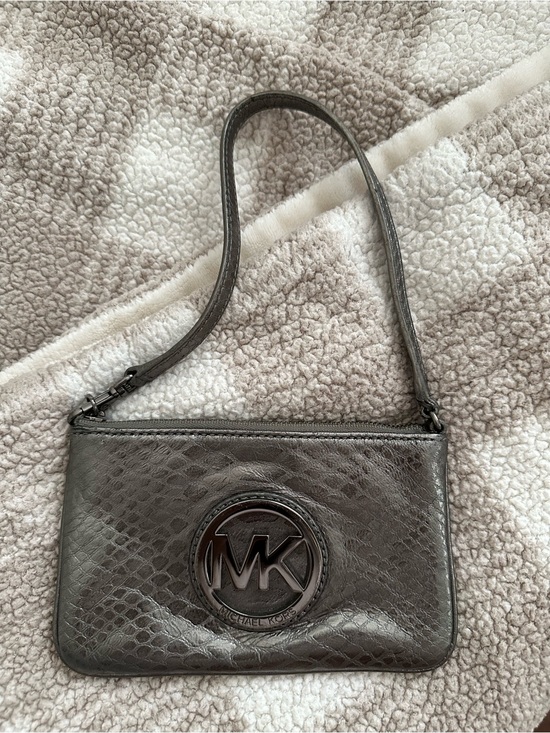 Michael Kors Handbags - Michael Kors Metallic Silver Embossed Logo Wristlet